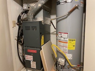 809 Plumpton Drive Austin, TX 78745 - Photo 12 of 14 Utility room featuring water heater and heating unit