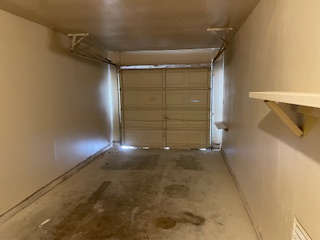 809 Plumpton Drive Austin, TX 78745 - Photo 13 of 14 Garage featuring baseboards