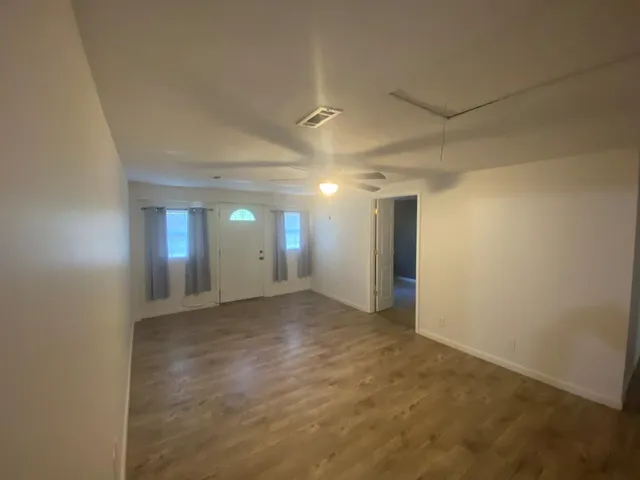 a view of an empty room and window