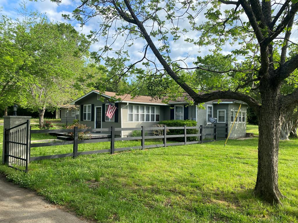 12165 Warm Springs Road Ellerslie, GA 31807 - Photo 4 of 15 a view of a house with a yard porch and sitting area