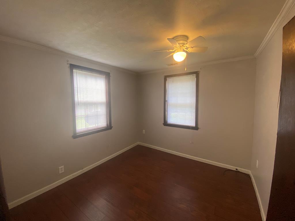 12165 Warm Springs Road Ellerslie, GA 31807 - Photo 5 of 15 an empty room with a window