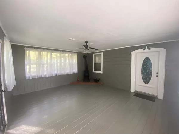 an empty room with a empty space and window