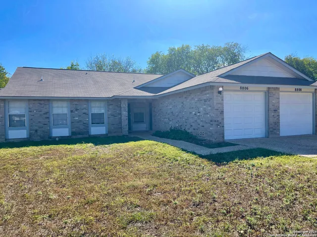 a view of a backyard of the house