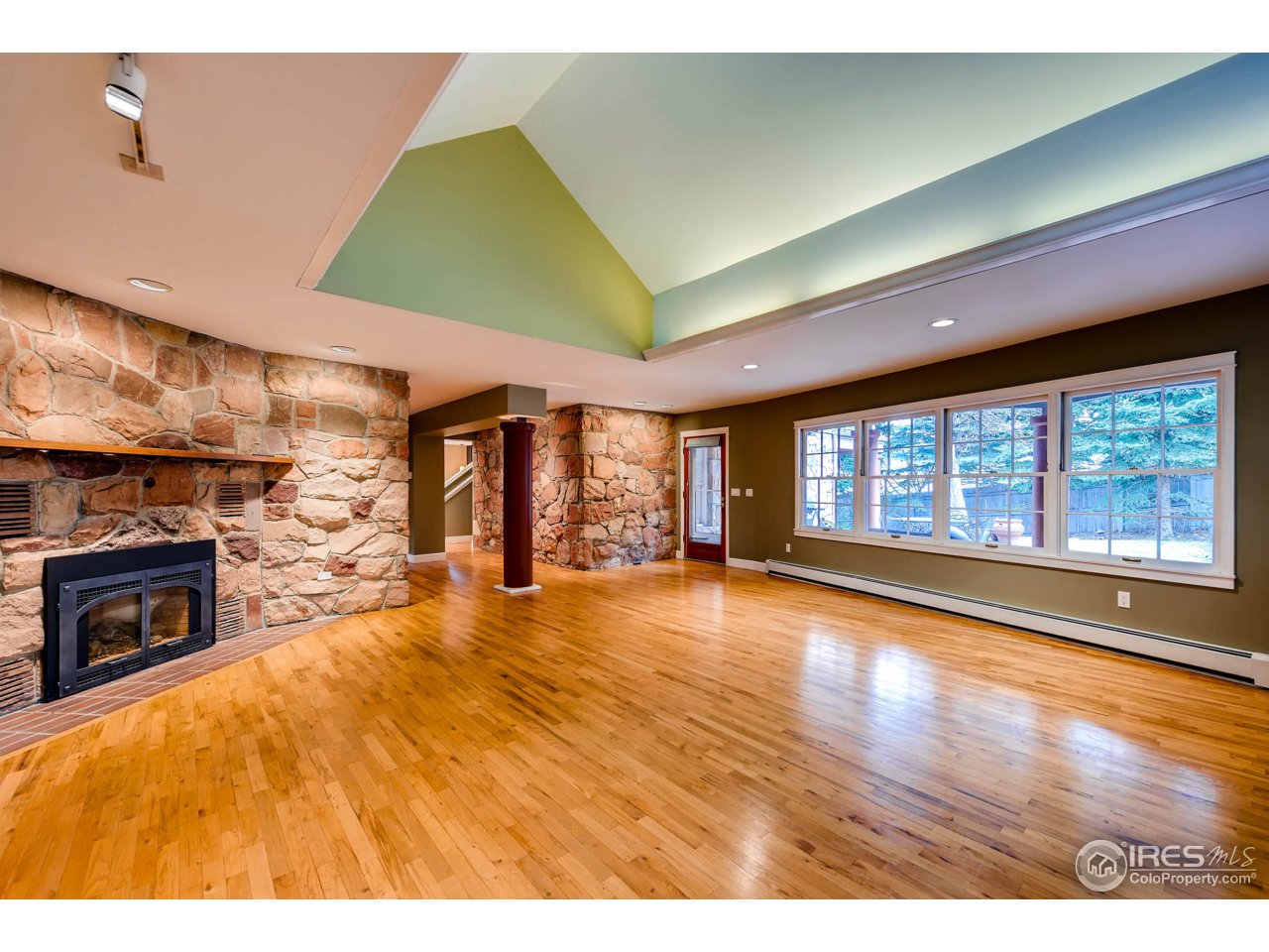 3555 4th Street Boulder, CO 80304 - Photo 11 of 30 a view of an empty room with a fireplace and a window