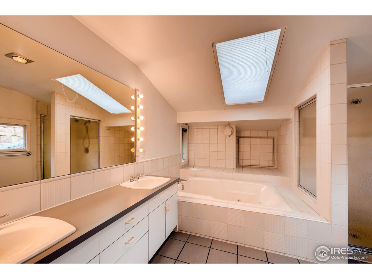 3555 4th Street Boulder, CO 80304 - Photo 15 of 30 a bathroom with a bathtub and a double vanity sink