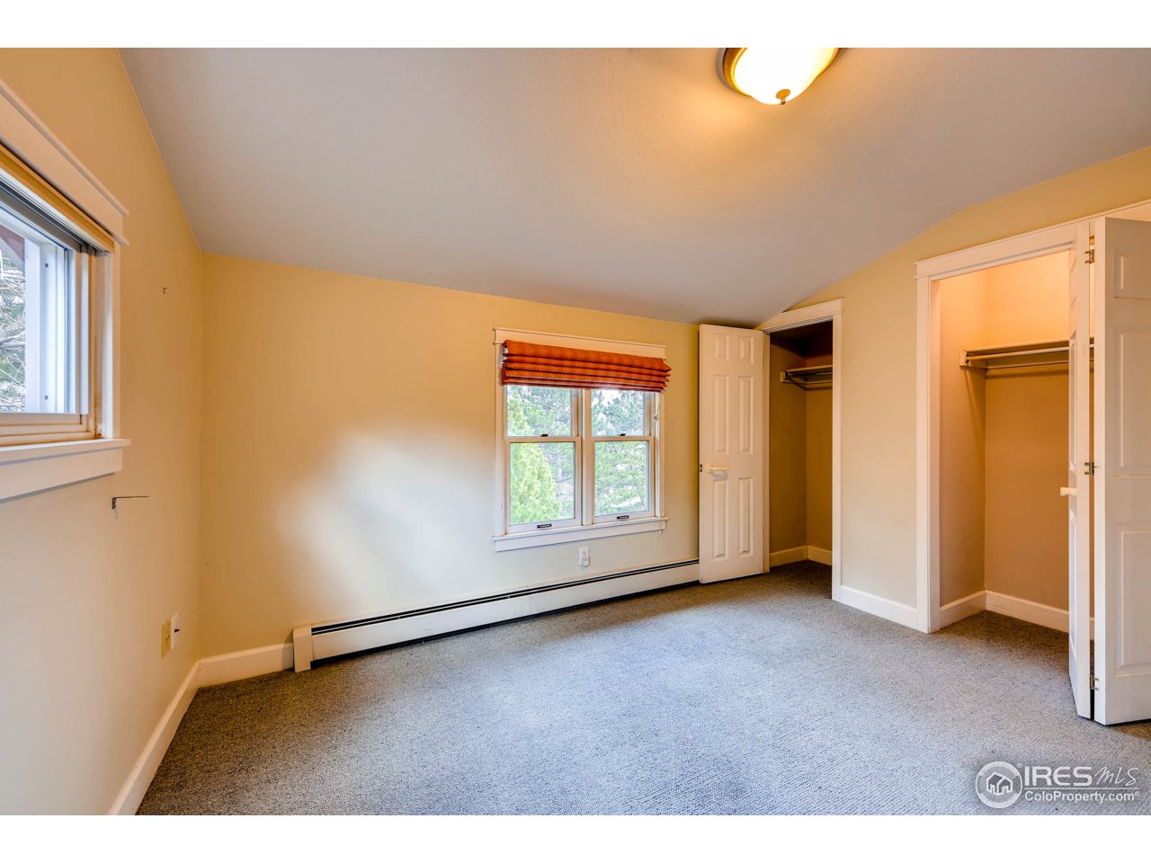 3555 4th Street Boulder, CO 80304 - Photo 17 of 30 a view of empty room with wooden floor and fan