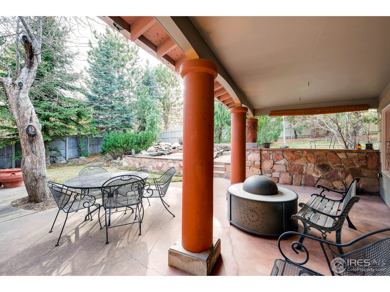 3555 4th Street Boulder, CO 80304 - Photo 22 of 30 a view of a patio with a dining table and chairs