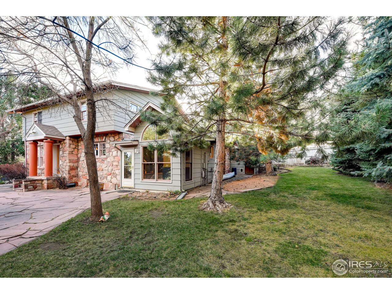 3555 4th Street Boulder, CO 80304 - Photo 26 of 30 a view of a house with a yard and tree s