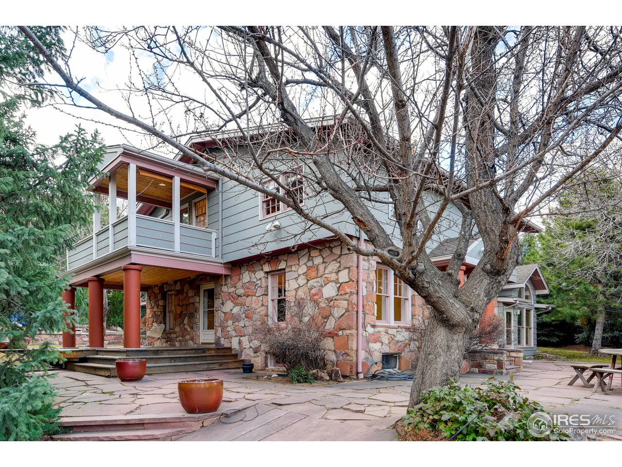 3555 4th Street Boulder, CO 80304 - Photo 4 of 30 a front view of house with yard outdoor seating and covered with trees