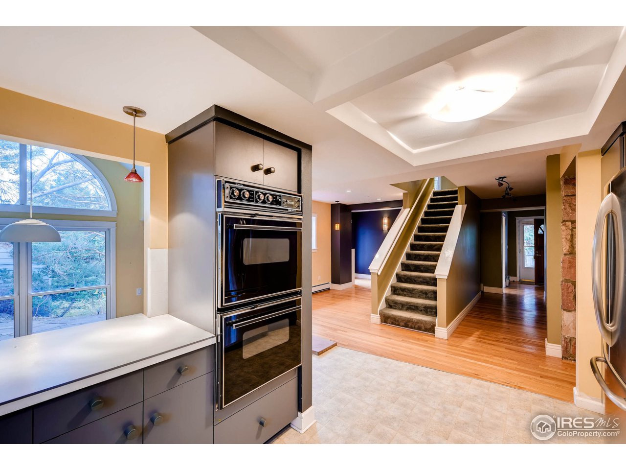 3555 4th Street Boulder, CO 80304 - Photo 9 of 30 a kitchen with wooden cabinets and a stove top oven