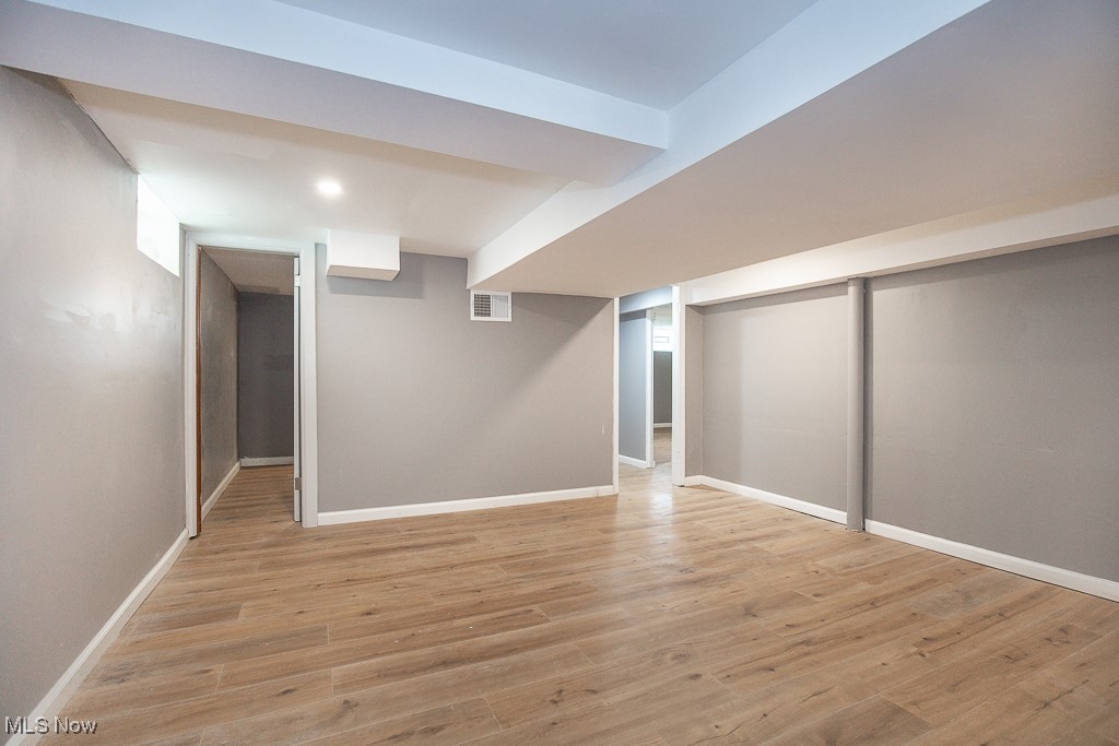 1547 Genesee Road South Euclid, OH 44121 - Photo 28 of 36 Finished basement with light wood-style floors and baseboards