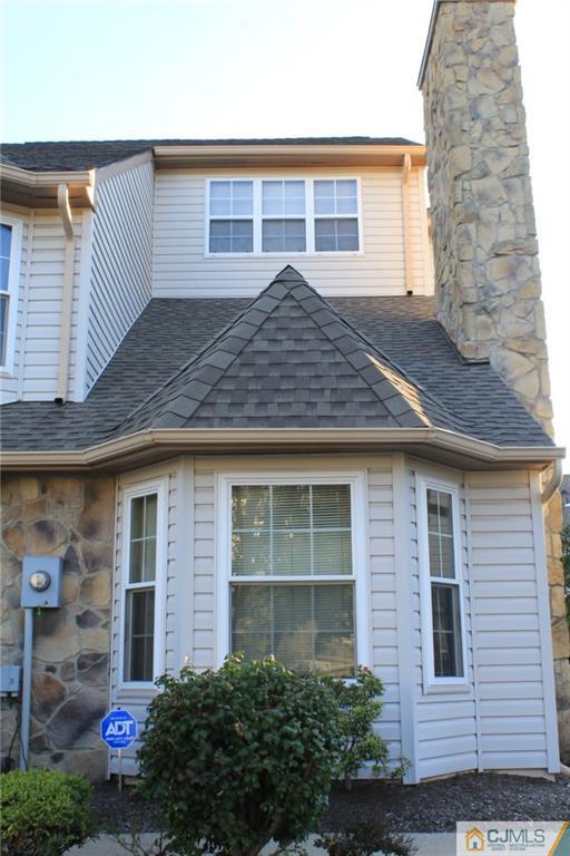 347 Lunar Road, Unit 347 Piscataway, NJ 08854 - Photo 1 of 4 a front view of a house with garden
