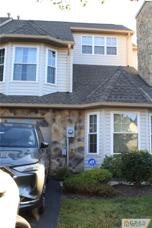 347 Lunar Road, Unit 347 Piscataway, NJ 08854 - Photo 2 of 4 a front view of a house with a yard