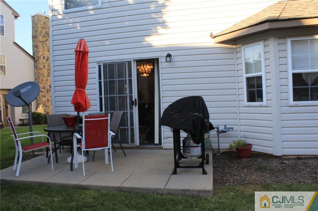 347 Lunar Road, Unit 347 Piscataway, NJ 08854 - Photo 4 of 4 a view of a two chairs in patio