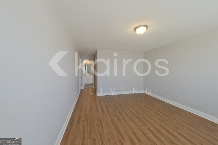 228 Western Red Cedar Drive Springfield, GA 31329 - Photo 20 of 27 a view of a room with wooden floor and white walls