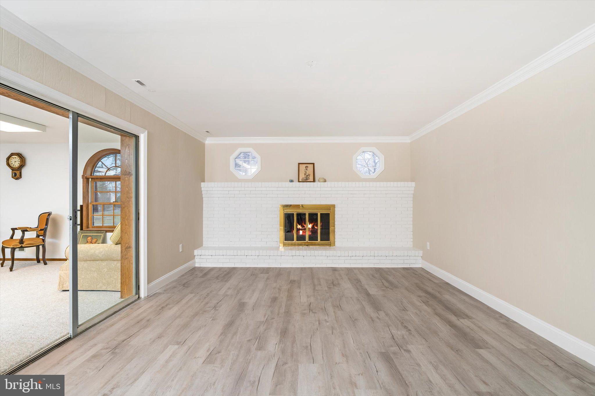 93 Tudor Drive Hamilton, NJ 08690 - Photo 46 of 67 a view of an empty room with wooden floor