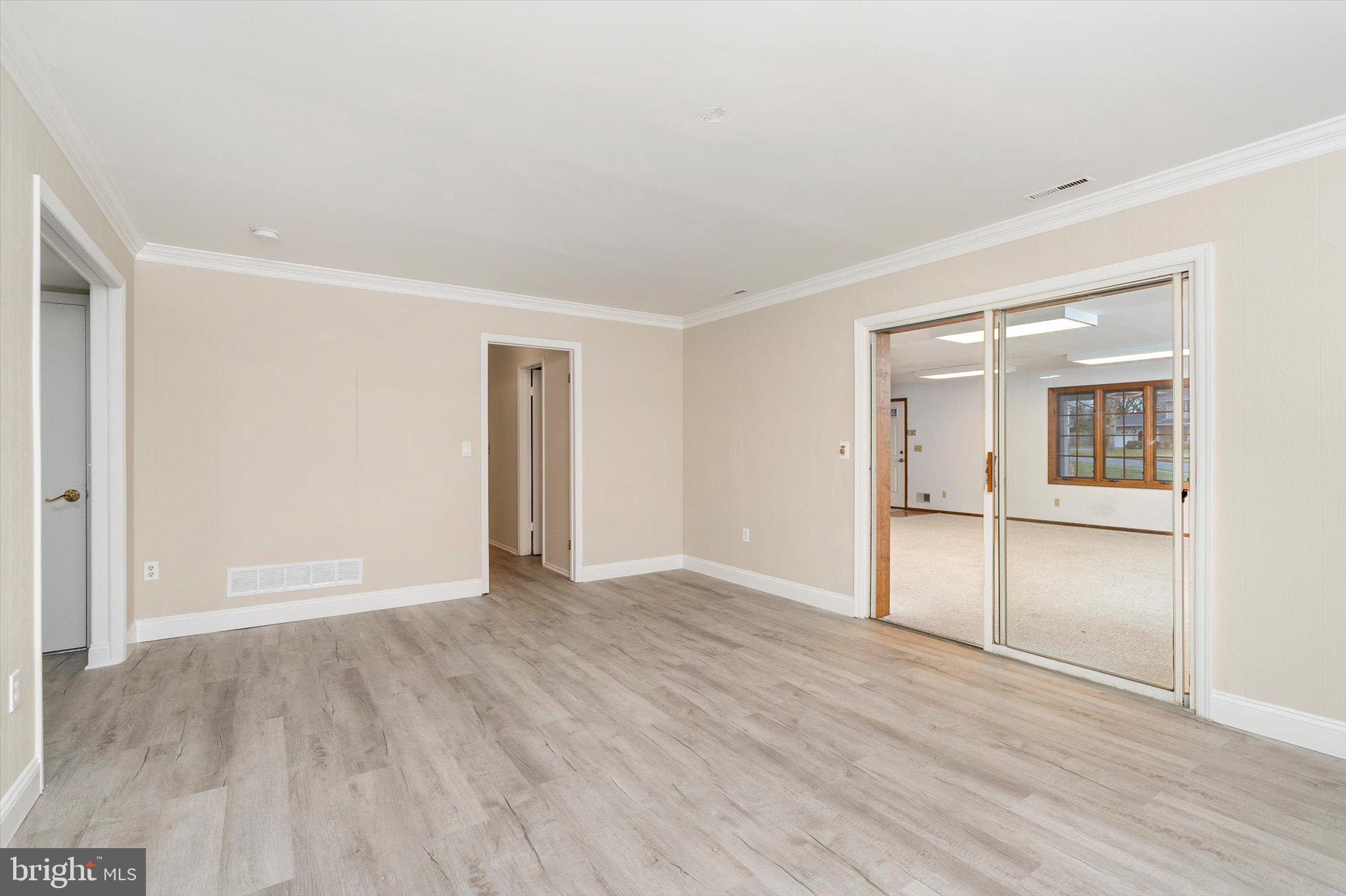 93 Tudor Drive Hamilton, NJ 08690 - Photo 47 of 67 a view of an empty room with wooden floor and closet