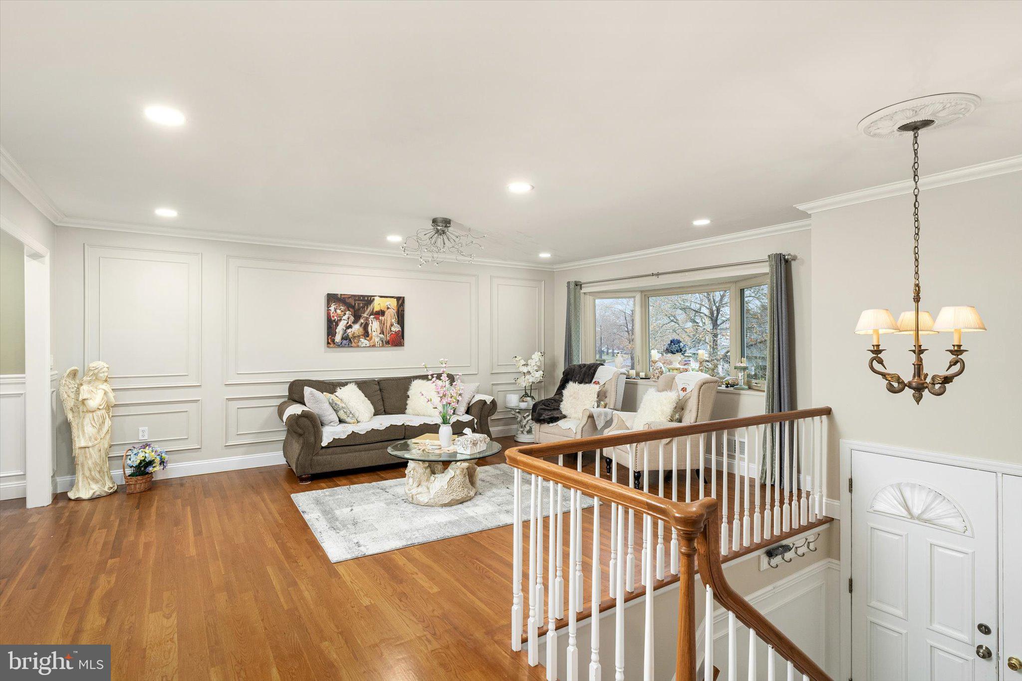 93 Tudor Drive Hamilton, NJ 08690 - Photo 5 of 67 a living room with furniture and wooden floor