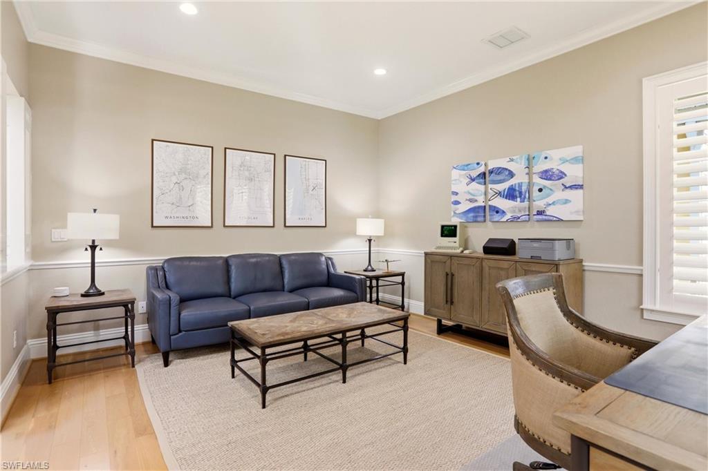 4335 7th Avenue Southwest Naples, FL 34119 - Photo 18 of 49 Living room with light wood-style floors, crown molding, a desk, and recessed lighting