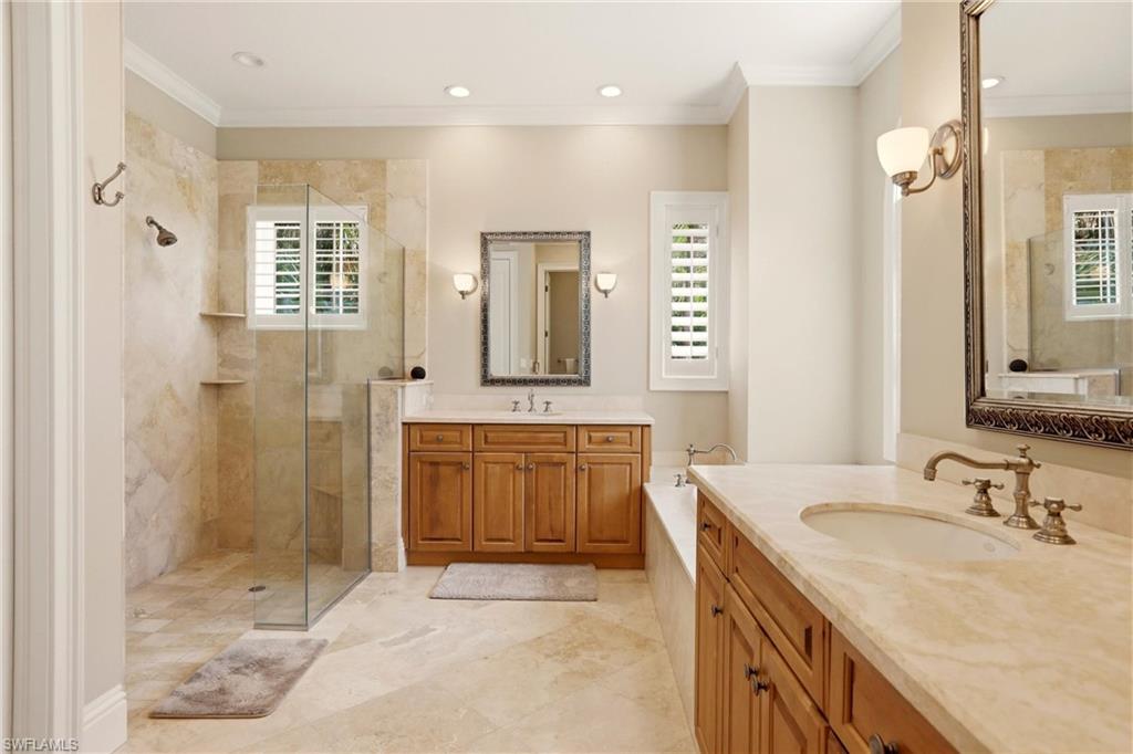 4335 7th Avenue Southwest Naples, FL 34119 - Photo 21 of 49 Full bathroom featuring two vanities, walk in shower, ornamental molding, a bath, and recessed lighting