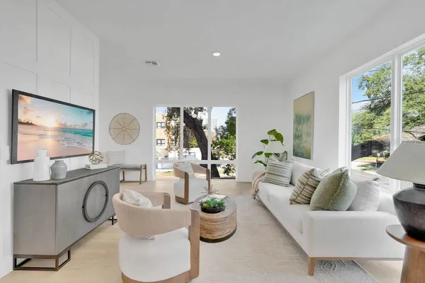 a living room with furniture and a window