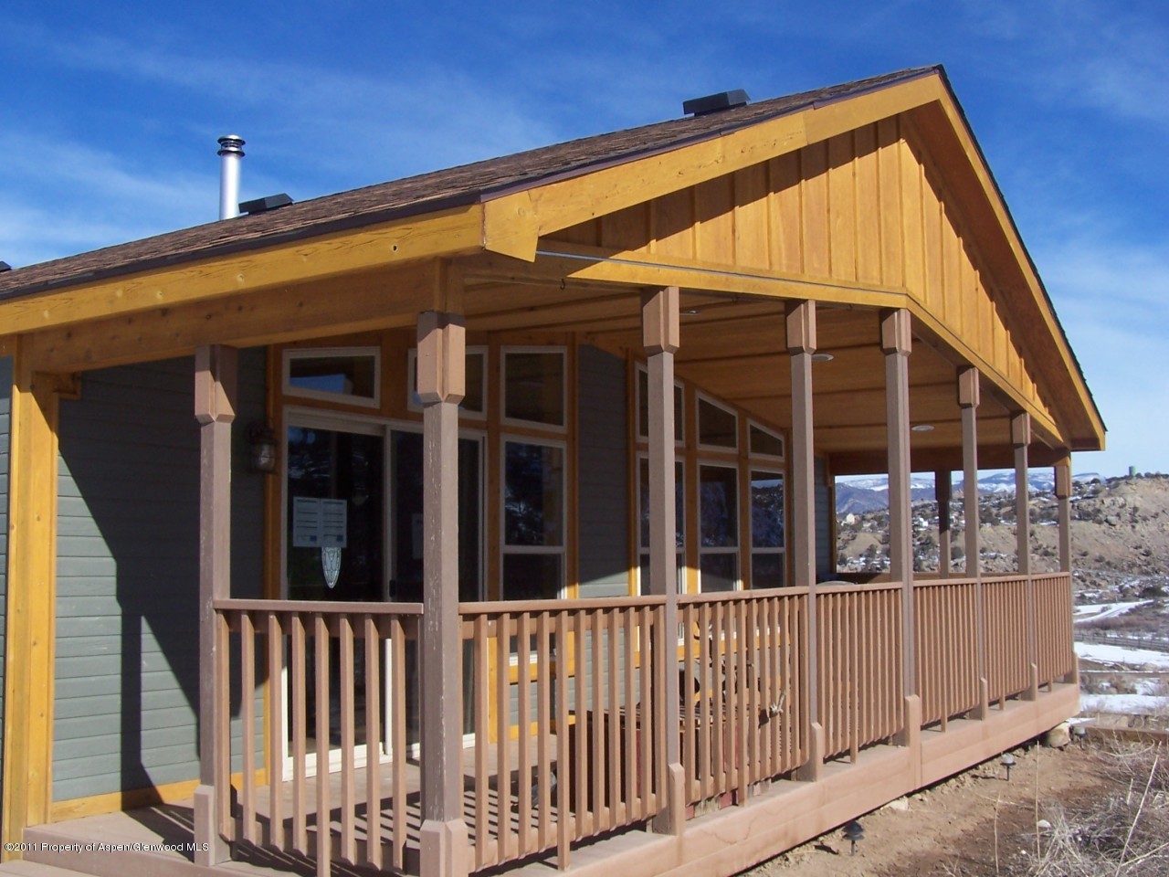 103 Chair Bar Road Silt, CO 81652 - Photo 1 of 1 a view of small house and wooden deck