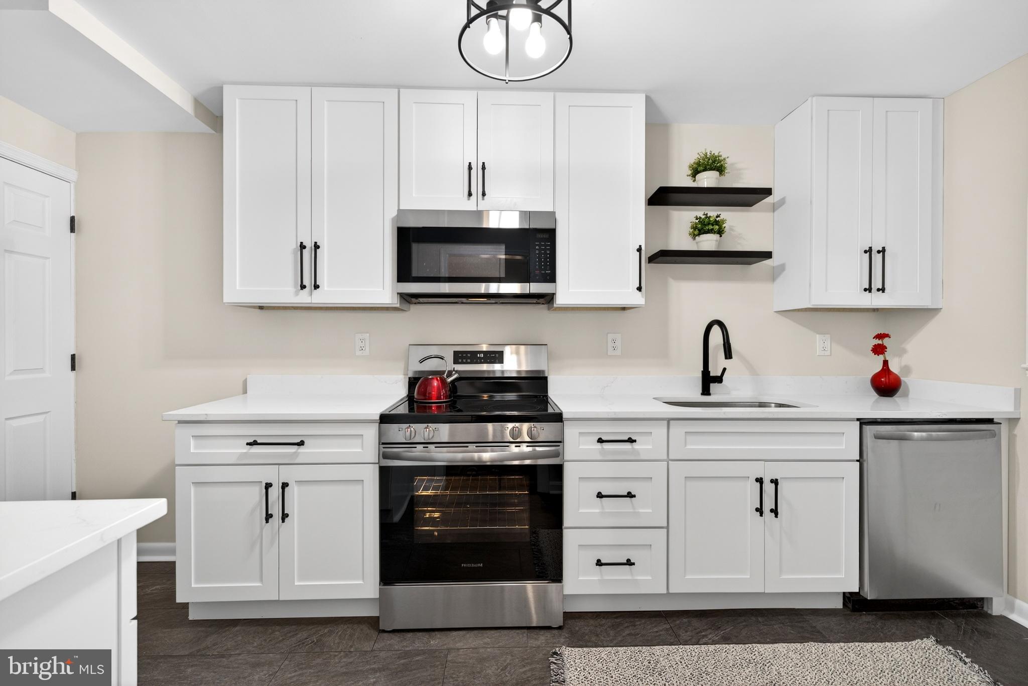 2115 Pitney Road Baltimore, MD 21234 - Photo 10 of 29 New quartz countertops and white shaker cabinets