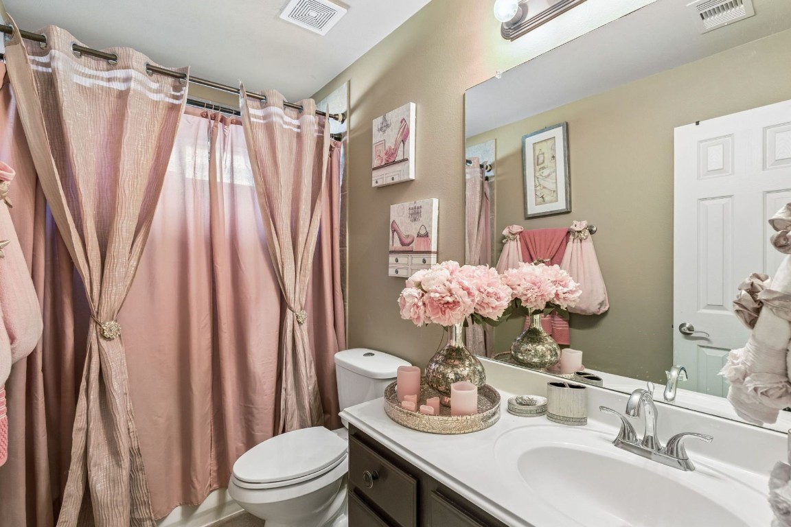 8211 Paddle Rock Lane Rosenberg, TX 77469 - Photo 16 of 24 a bathroom with a sink toilet and shower
