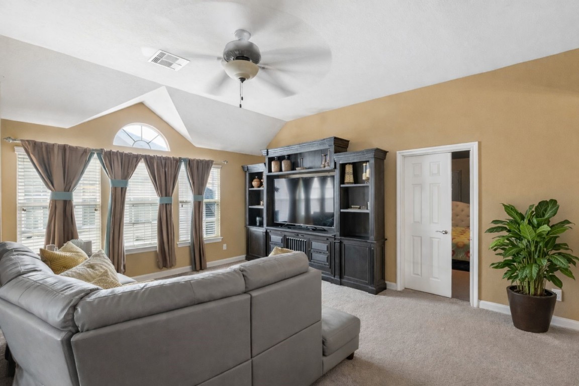 8211 Paddle Rock Lane Rosenberg, TX 77469 - Photo 18 of 24 a living room with furniture ceiling fan and a window