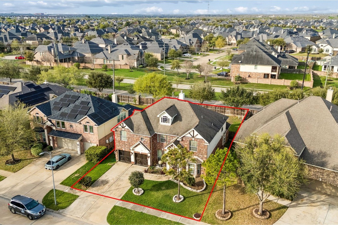 8211 Paddle Rock Lane Rosenberg, TX 77469 - Photo 22 of 24 an aerial view of a house with a big yard