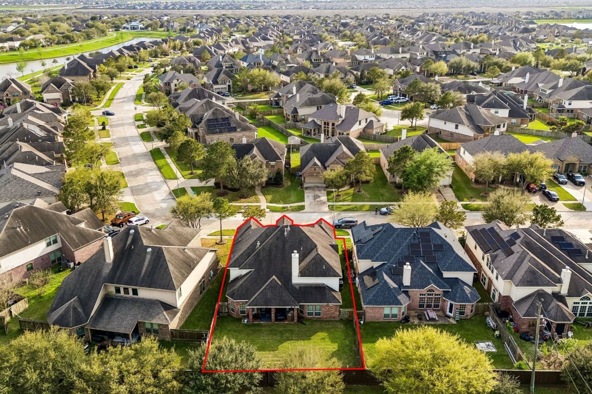 8211 Paddle Rock Lane Rosenberg, TX 77469 - Photo 23 of 24 an aerial view of a house with a garden