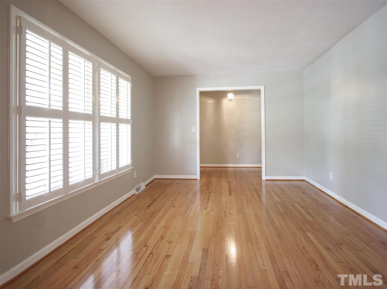 1324 Kingston Ridge Road Cary, NC 27511 - Photo 13 of 30 The formal living room is at the front of the house. Wonderful wall of windows with Plantation shutters brings in the natural light. Newly repainted inside with an up-to-date color scheme, the home is move-in ready.