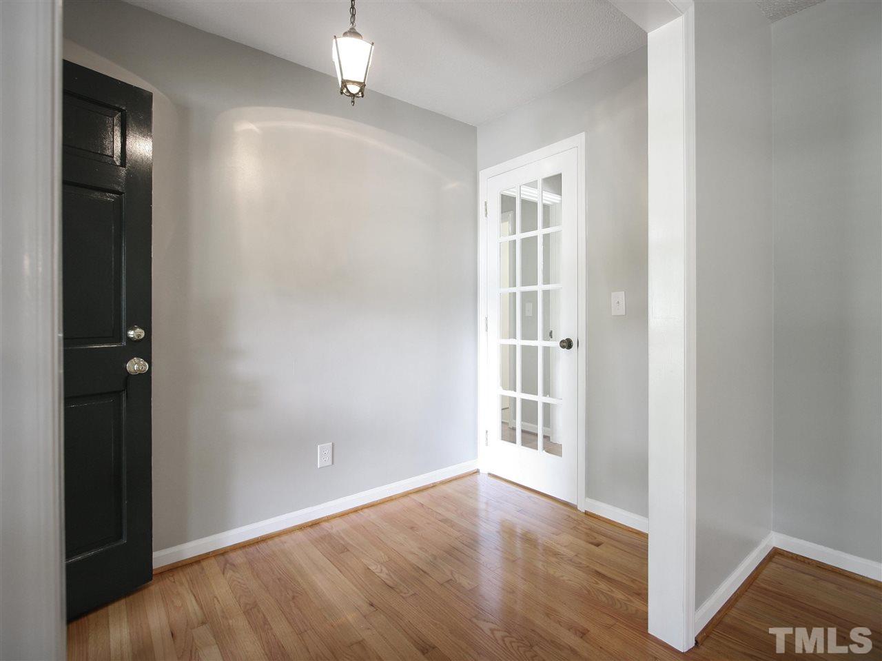 1324 Kingston Ridge Road Cary, NC 27511 - Photo 15 of 30 Foyer is open to the living room. It has a 15-panel glass door to the hallway and family room beyond.