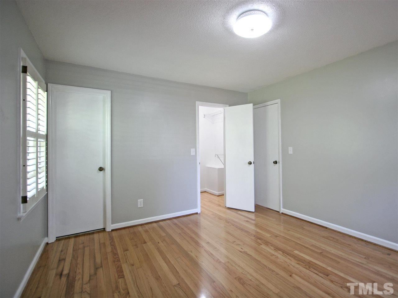 1324 Kingston Ridge Road Cary, NC 27511 - Photo 20 of 30 Spacious Owner's suite has hardwood flooring, walk-in closet, and en suite bath.