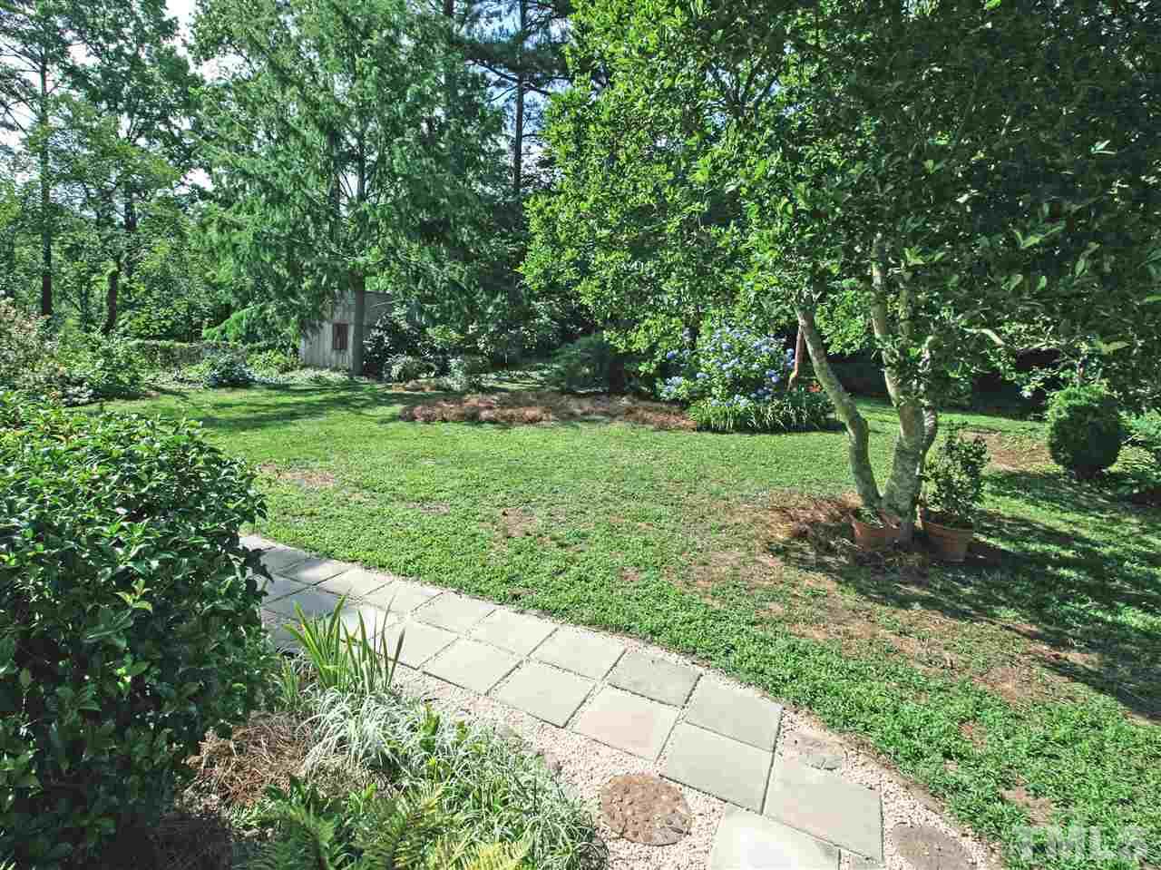 1324 Kingston Ridge Road Cary, NC 27511 - Photo 24 of 30 Backyard is huge and is fully fenced--a great space for play or pets, a vegetable or herb garden, flower garden, or just as a quiet spot to relax.
