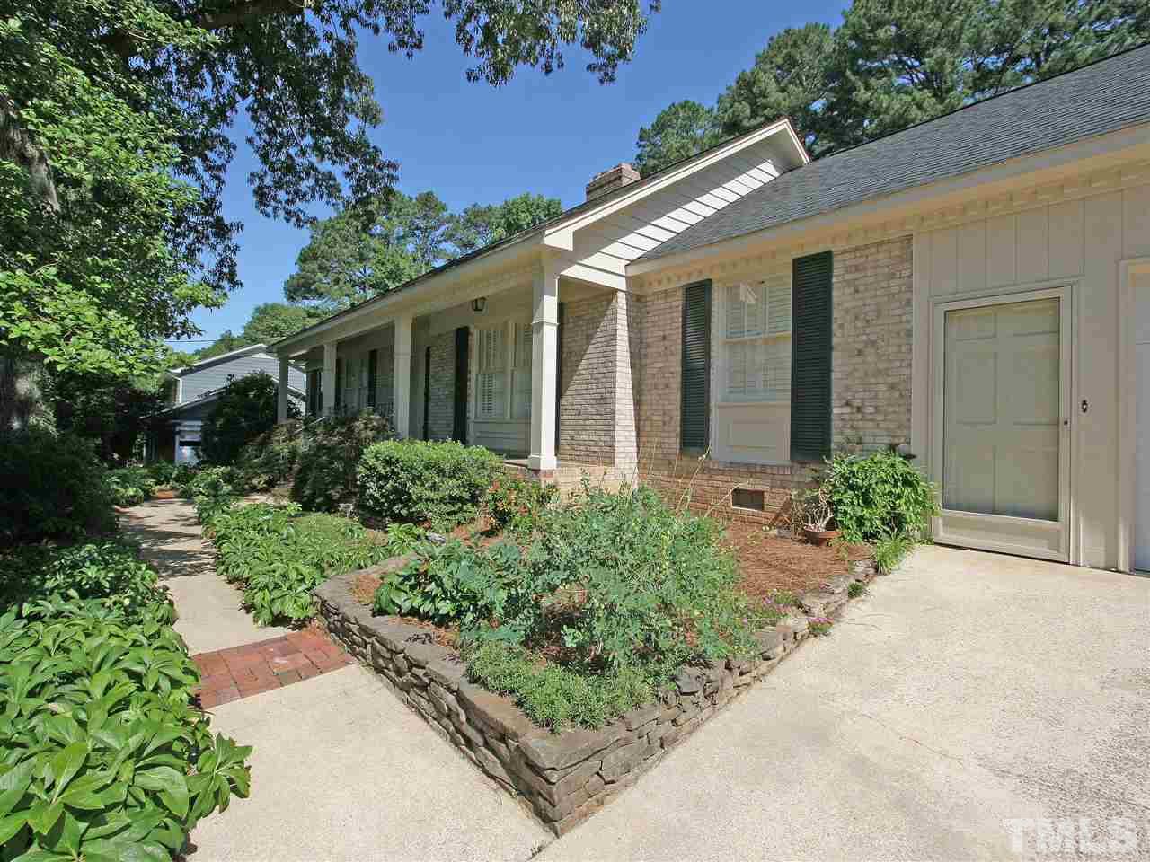 1324 Kingston Ridge Road Cary, NC 27511 - Photo 3 of 30 This garden walkway leads to the front door. Or enter through the garage from the pedestrian or the overhead door.