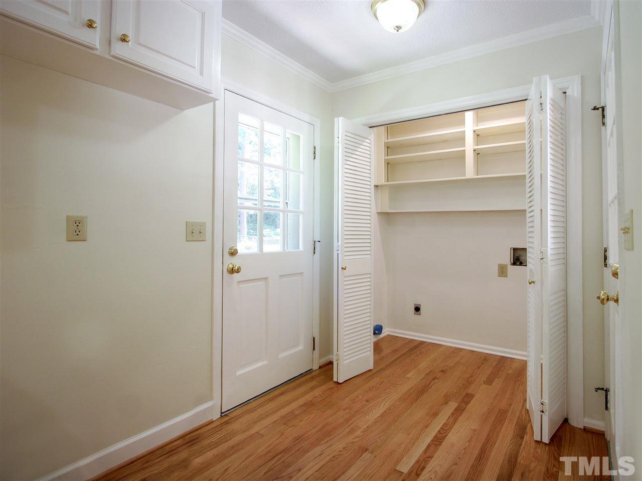 1324 Kingston Ridge Road Cary, NC 27511 - Photo 7 of 30 This photo shows the laundry. Note the wood shelving.