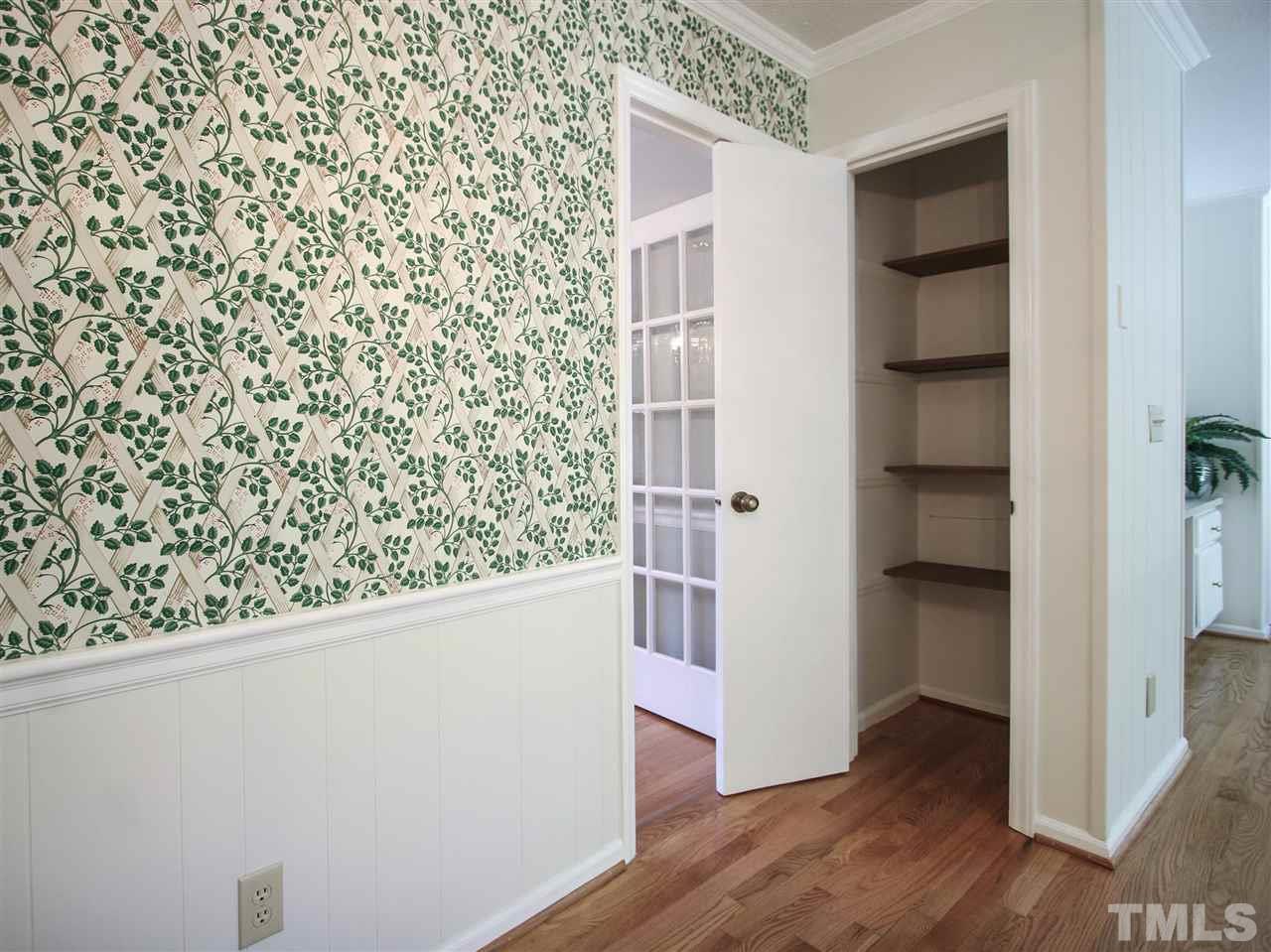 1324 Kingston Ridge Road Cary, NC 27511 - Photo 9 of 30 Shown here is the pantry. It has wood shelving.