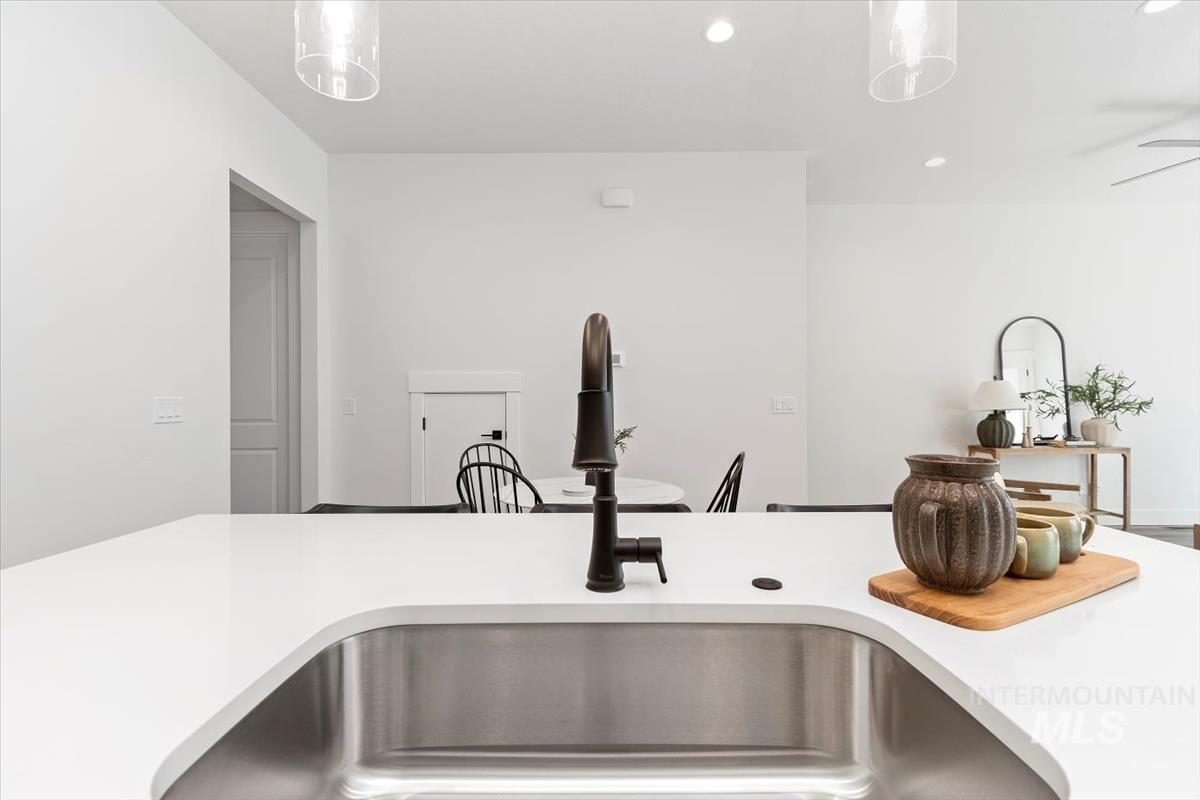 720 South Calhoun Place Star, ID 83669 - Photo 11 of 43 Kitchen featuring recessed lighting, a breakfast bar, and hanging light fixtures