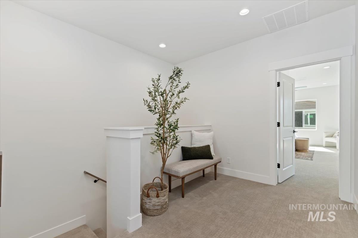720 South Calhoun Place Star, ID 83669 - Photo 20 of 43 Sitting room with light colored carpet, an upstairs landing, and recessed lighting