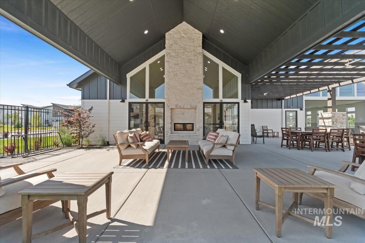 720 South Calhoun Place Star, ID 83669 - Photo 41 of 43 View of patio with an outdoor living space with a fireplace and outdoor dining area