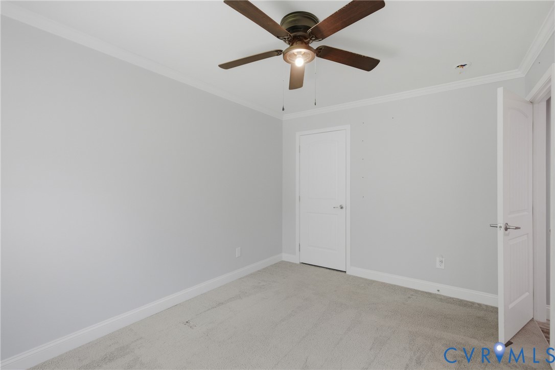 93 Faraway Road Saluda, VA 23149 - Photo 26 of 58 en empty room with ceiling fan