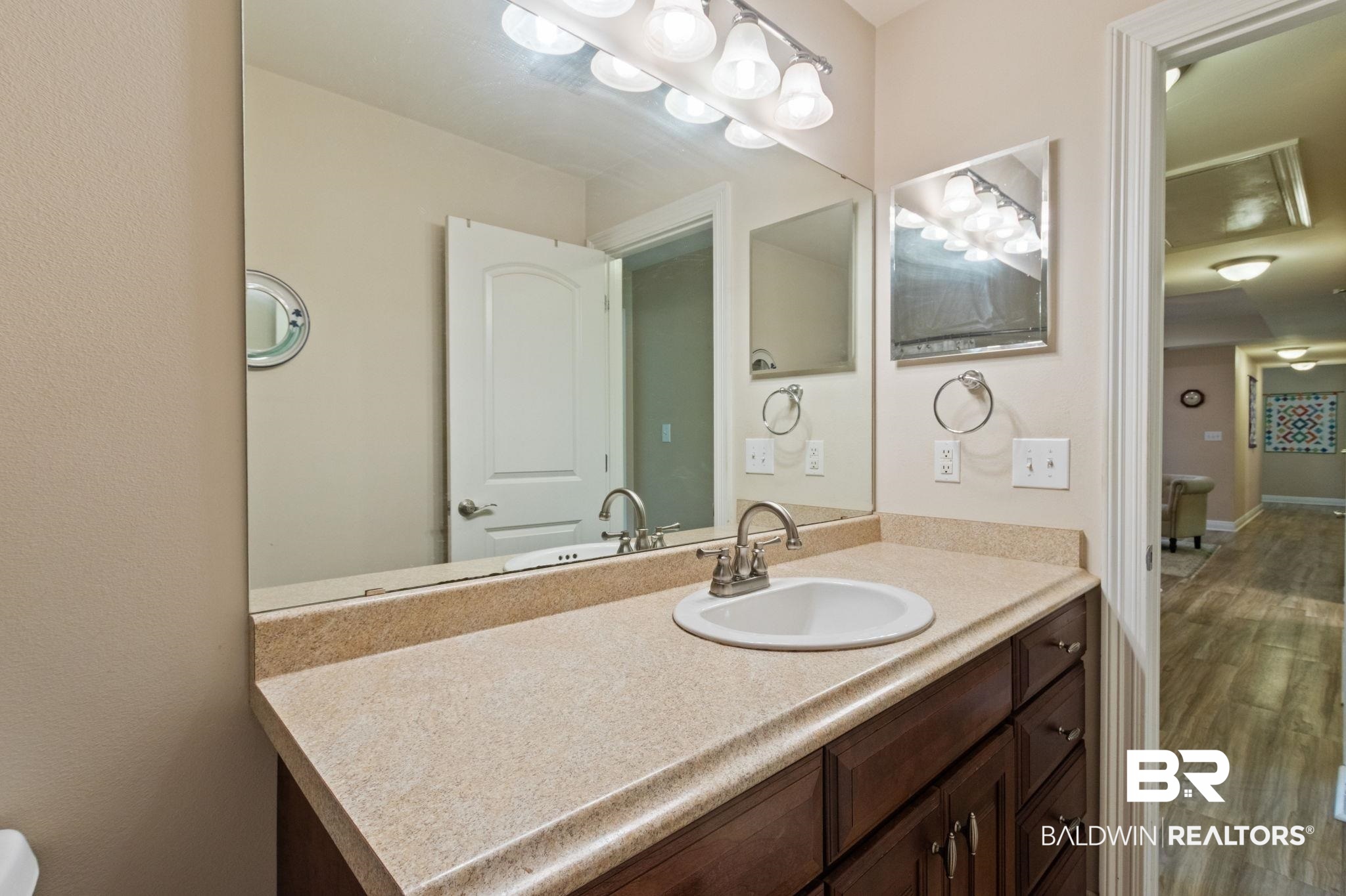 24250 Hack Road Bay Minette, AL 36507 - Photo 35 of 88 Bathroom featuring vanity and wood finished floors