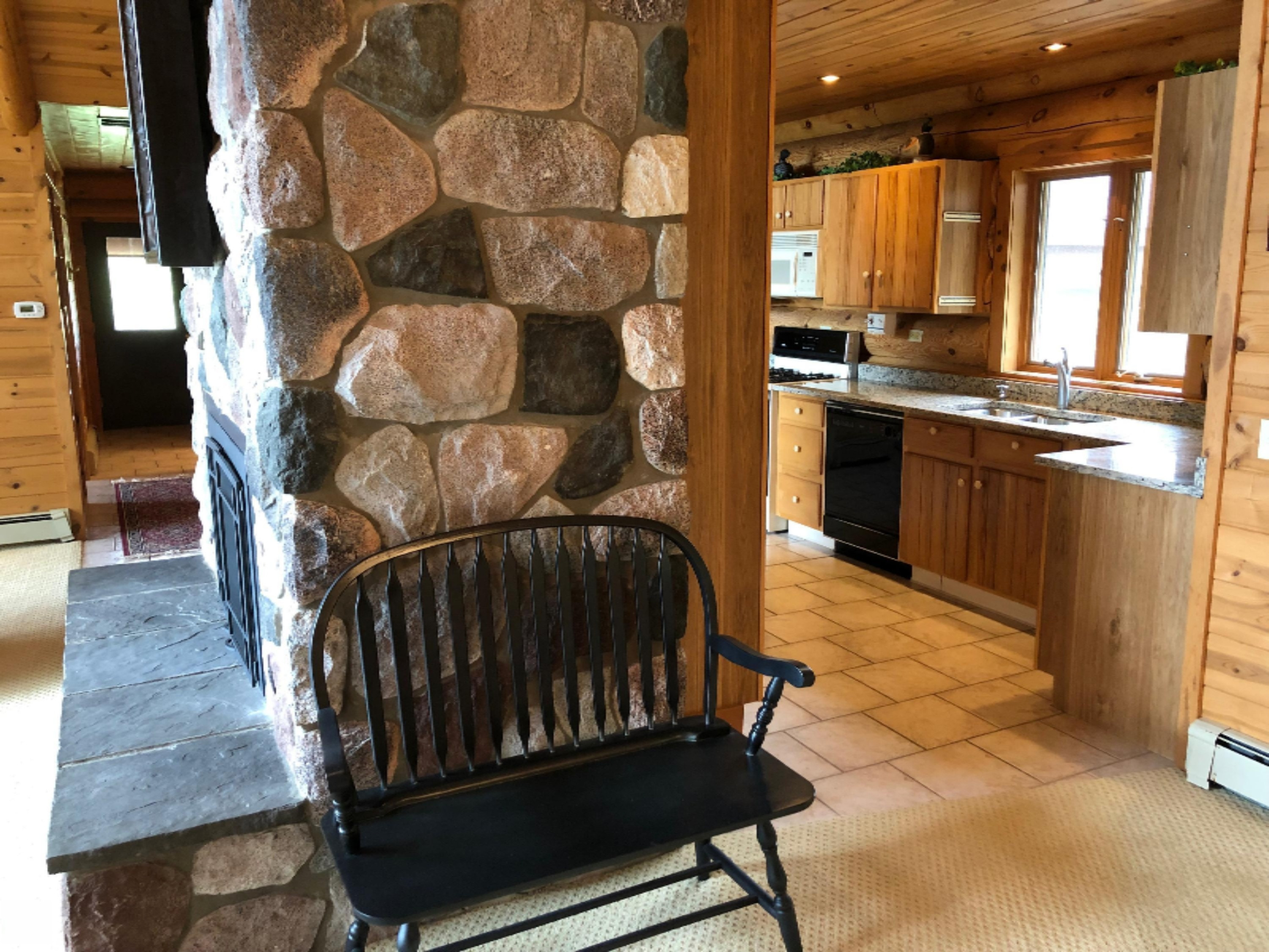 2536 Crescent Beach Road Manistee, MI 49660 - Photo 14 of 55 Fireplace Separates Kitchen