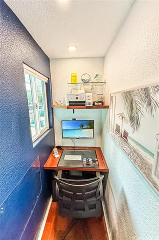 a room with chair and wooden floor