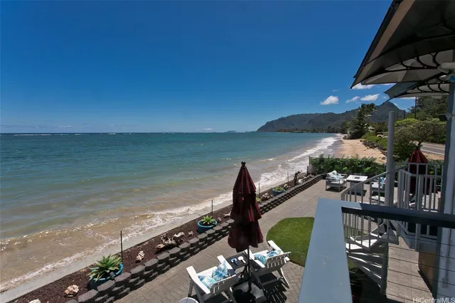 a view of a balcony with wooden floor and outdoor space