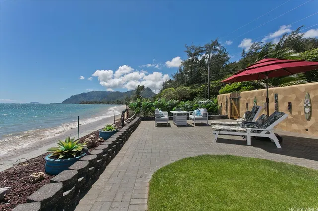 a view of a backyard with sitting area