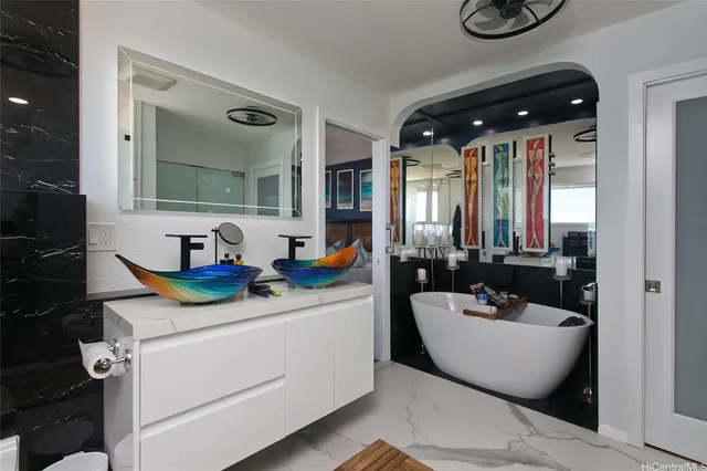 a bathroom with a sink a mirror and a window