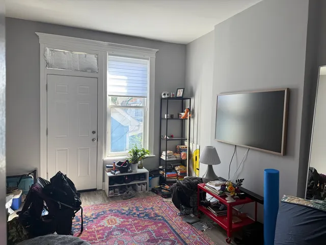 a kitchen with stainless steel appliances a refrigerator sink and wooden cabinets