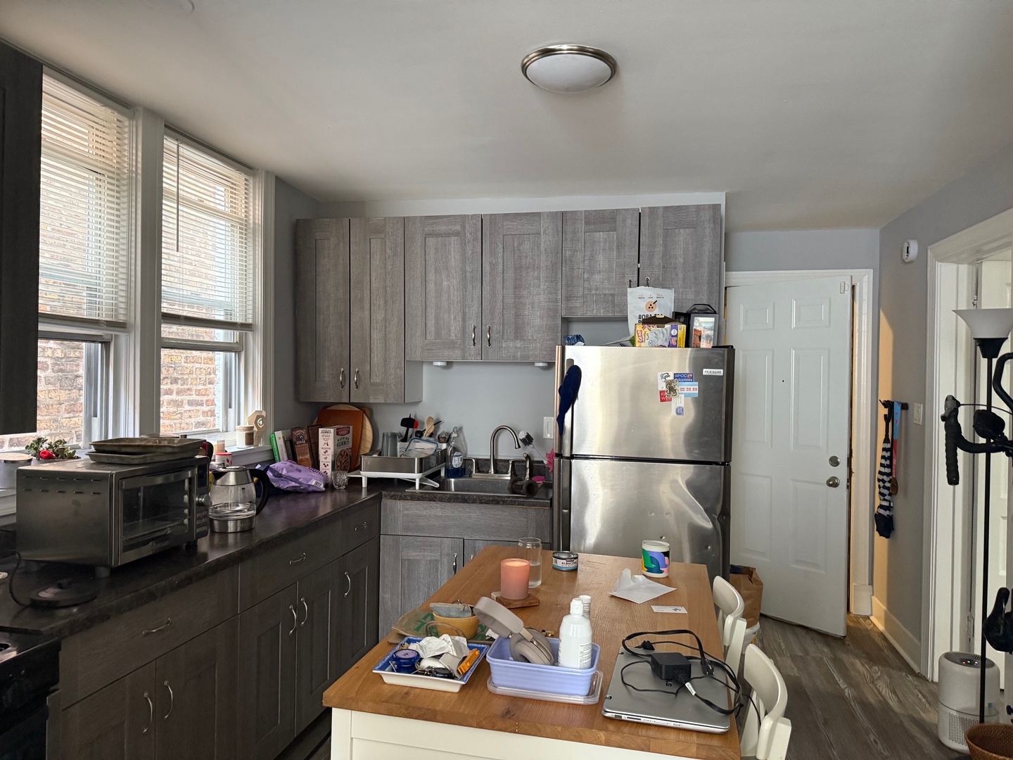 827 North Fairfield Avenue Chicago, IL 60622 - Photo 20 of 55 a kitchen with stainless steel appliances a refrigerator sink and wooden cabinets